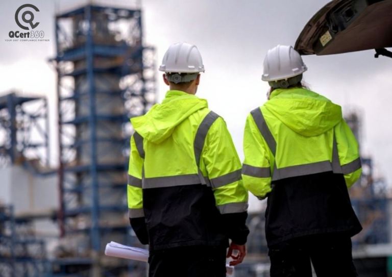 Two professionals reviewing safety and environmental compliance documents in an ISO-certified industrial workplace.